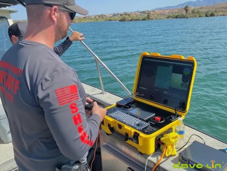 Operator controlling an ROV from a portable surface power console