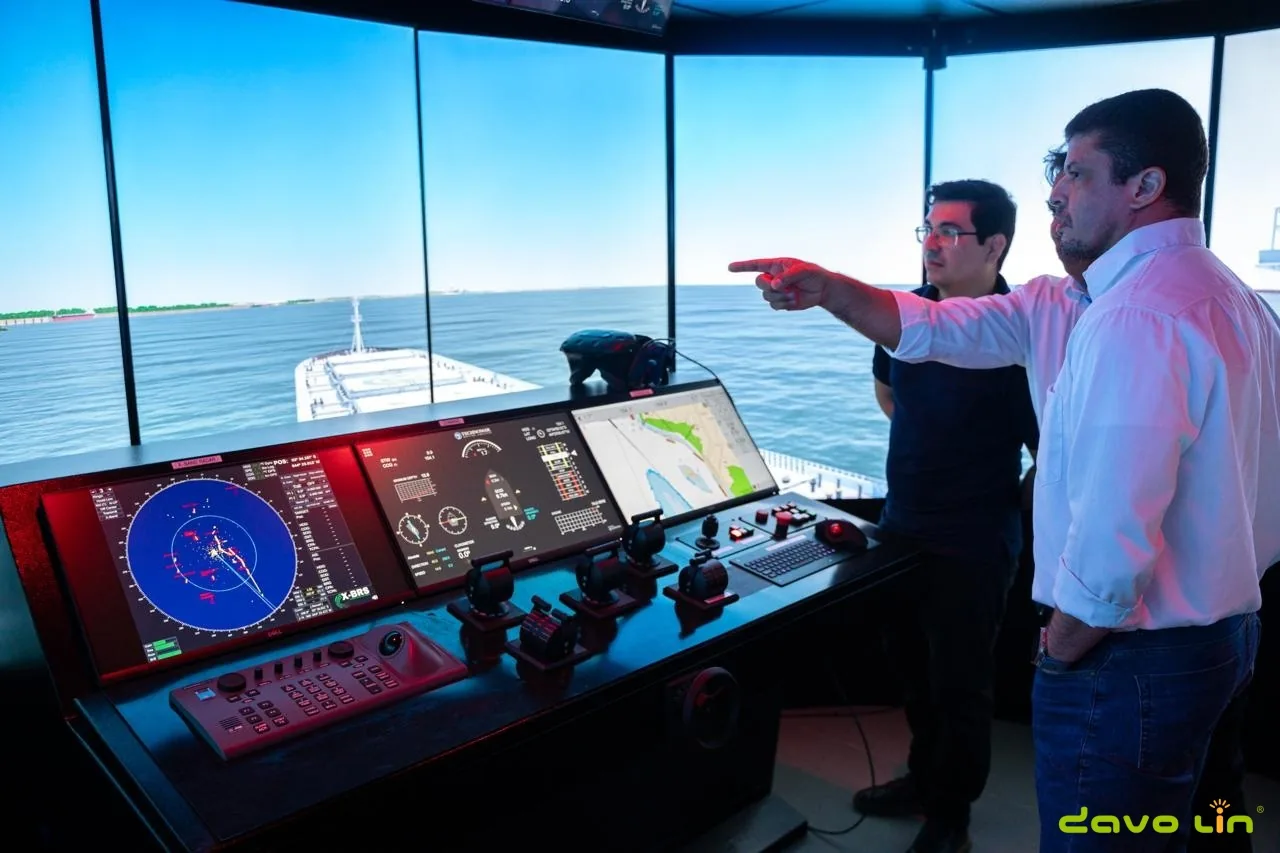 Trainees operating a multi-display ship bridge simulator